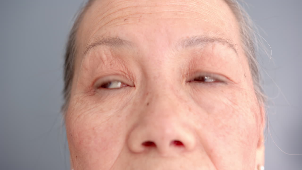 Close-up of elderly woman's face with focus on eyes and wrinkles