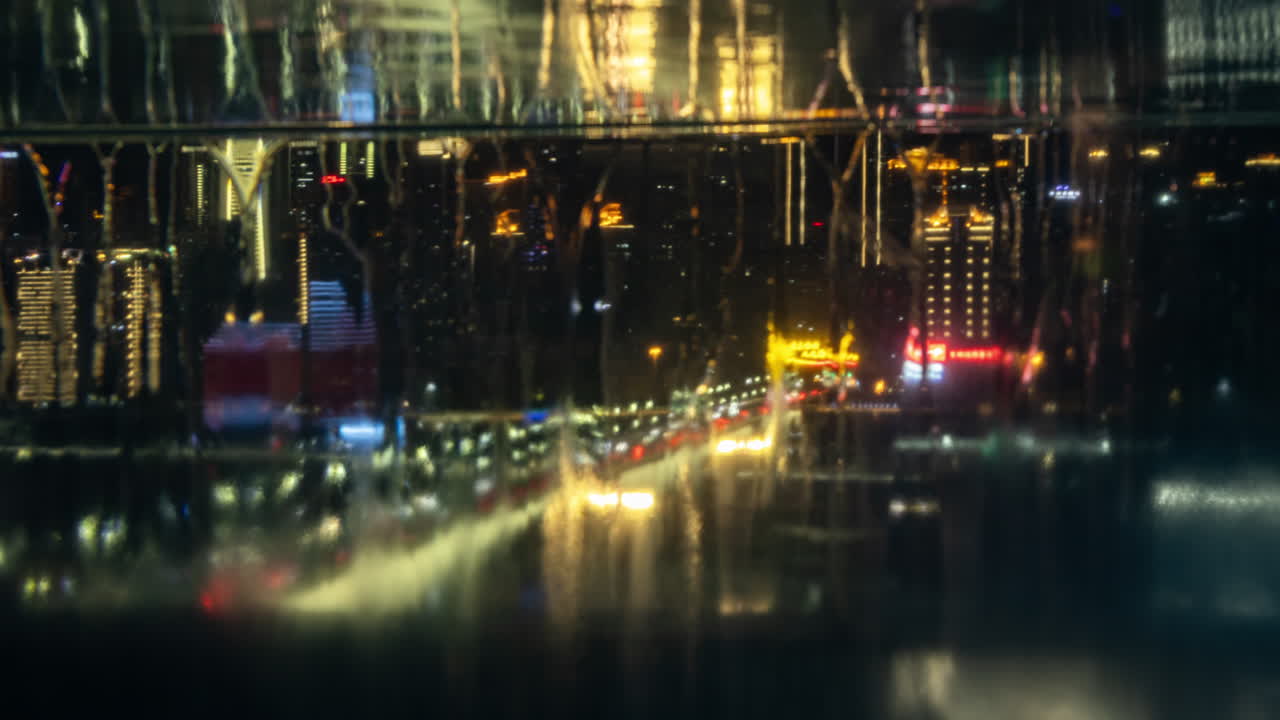 Timelapse of the amazing Chongqing cyberpunk city skyline reflected in a pool at night