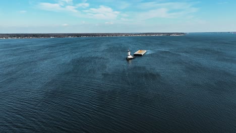 slow motion high aerial of a tug boat in winter