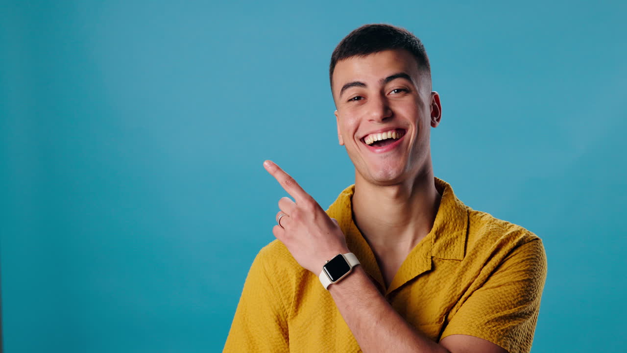 Man pointing and smiling