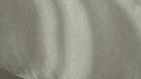 textured fabric with natural light shadows