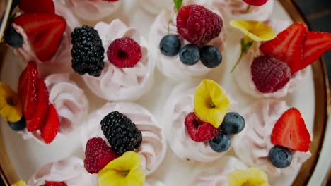 dessert plate with fruit cream sweets, top down view