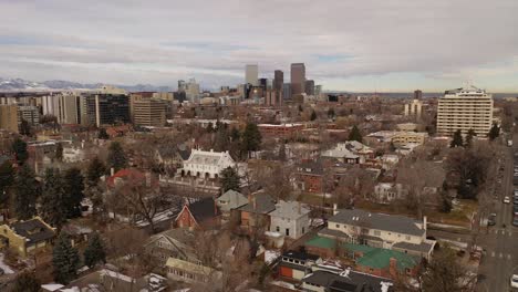 a reverse pan of denver colorado on a winter's day