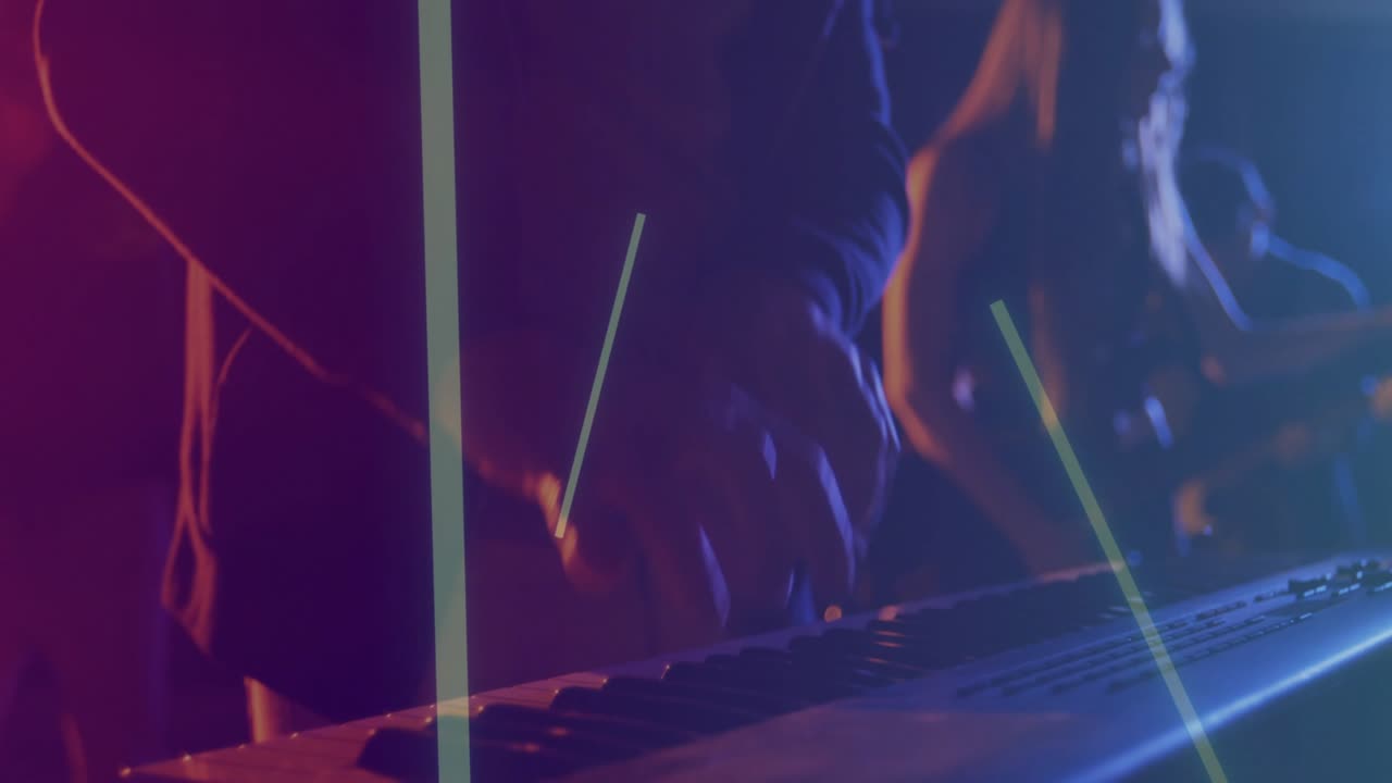Keyboardist playing synth in live music LED bars sweeping, shot moving closer hands pressing keys
