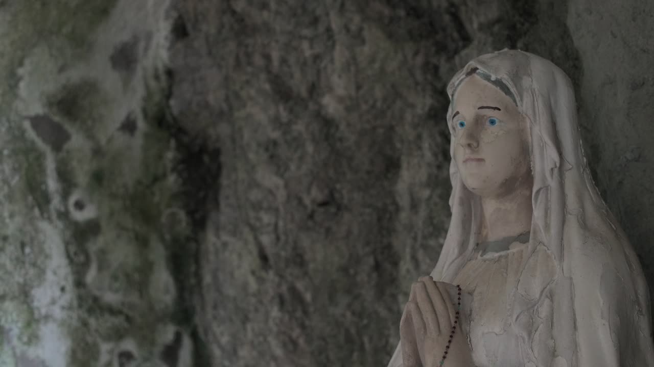 A statue of the Madonna graces a church carved into the the mountaintop caves of Campania, Italy.