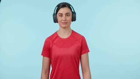 fitness, headphones and watch of a woman in studio