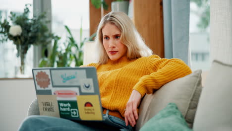 woman with shocked expression looking at laptop