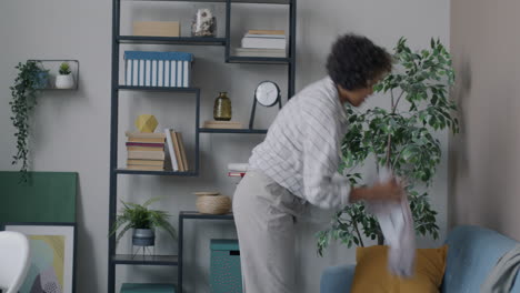 woman organizing laundry basket in living room