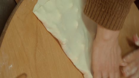 preparing traditional food with spinach and cheese filling