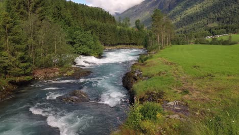 mountain river beautiful nature norway natural landscape. aerial footage lovatnet lake lodal valley.