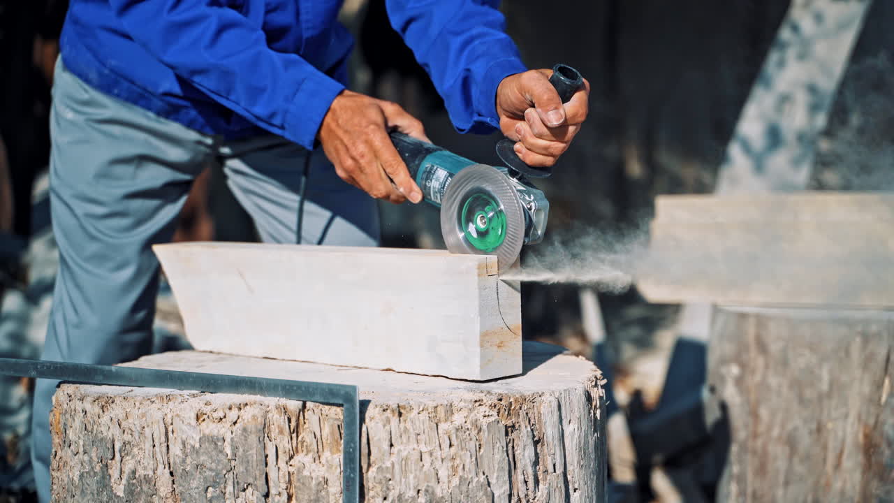 Processing of white marble. Stone processing industry with circular saw