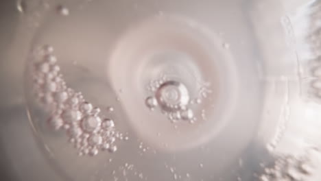 water with oxygen bubbles oscillates in bottle with nipple