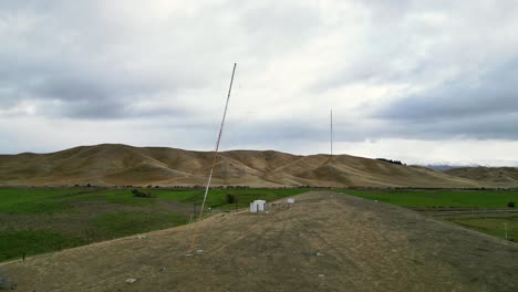 drone shot deconstruction of communications mast – remote new zealand landscape