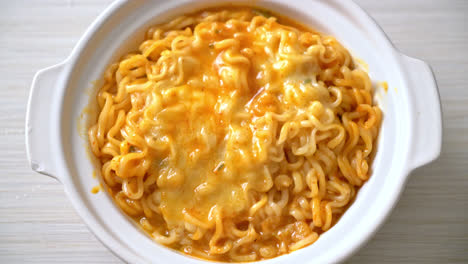 spicy instant noodle bowl with mozzarella cheese