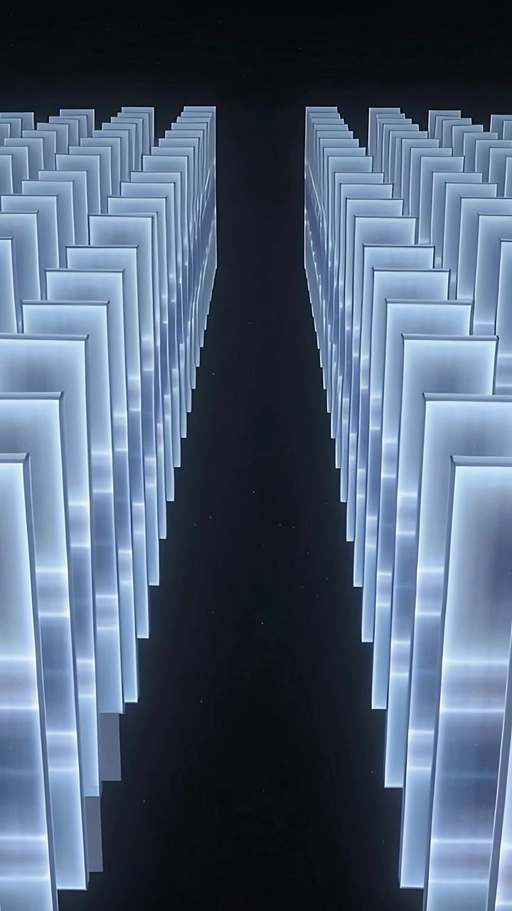 Vertical video: Gliding camera revealing twin lit panels down dark gallery aisle showing symmetry