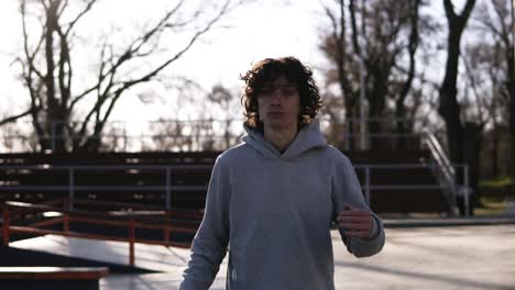 Portrait-Of-A-Handsome-Young-Man-With-Dark-Curly-Hair-1