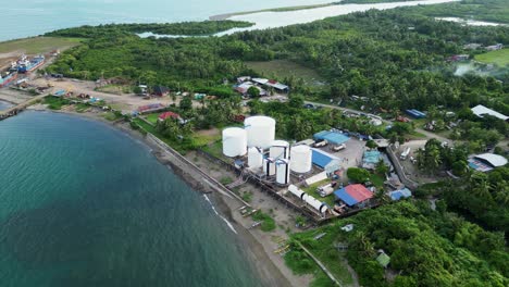 overhead aerial drone shot of fuel storage facility compound at tropical island location in catanduanes, philippines