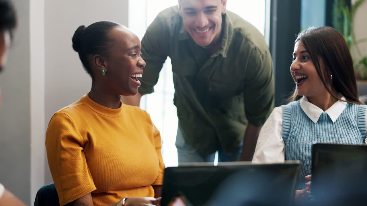 Happy Diverse Colleagues Laughing and Discussing Ideas in Modern Office