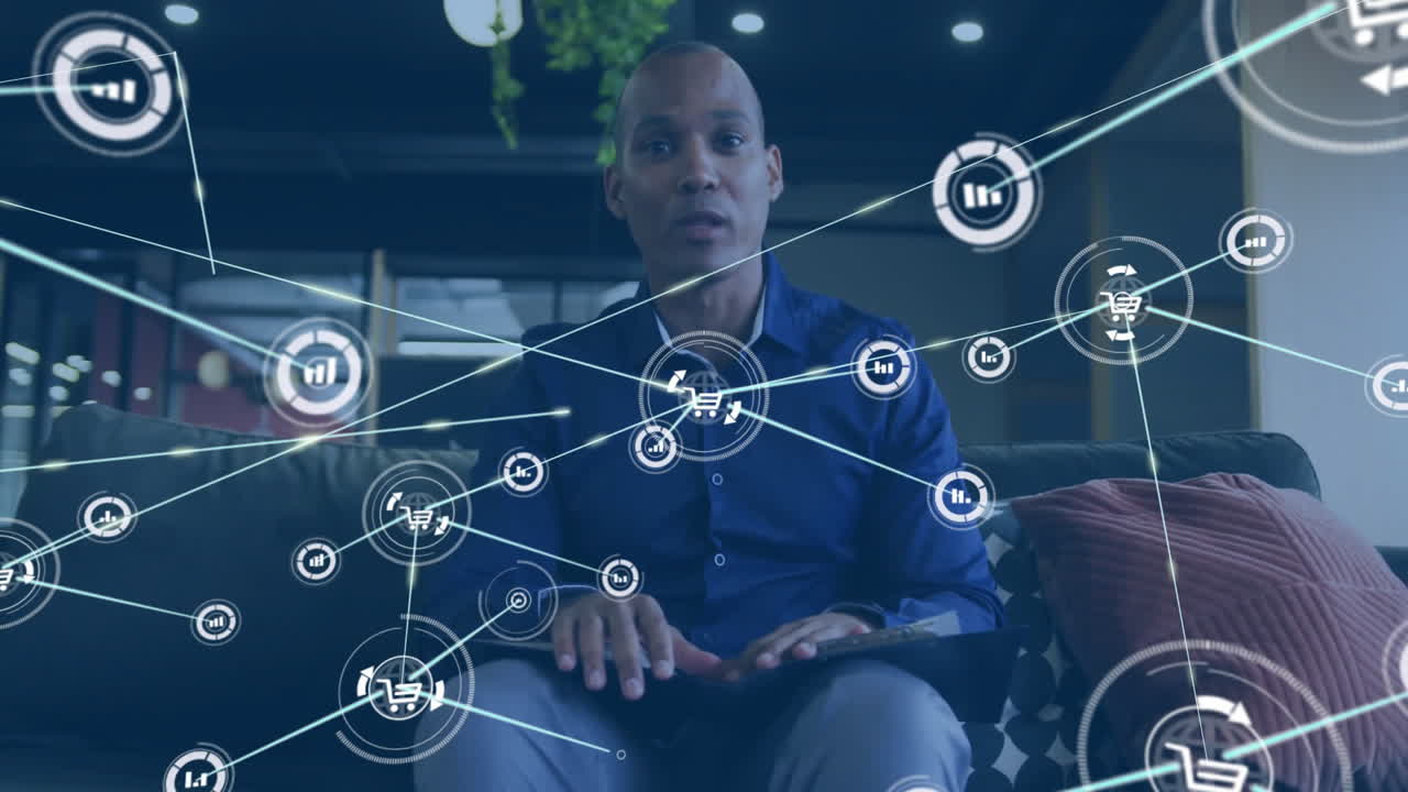 Animation of network of connections over african american businessman having video call in office