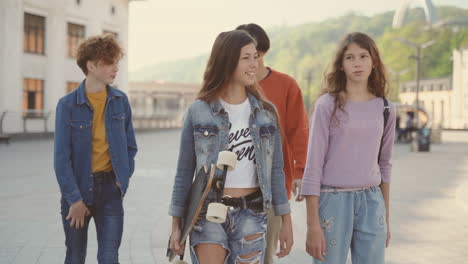 a group of teenagers walk down the street 1