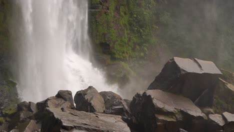 close up of the powerful and strong nauyaca waterfall in costa rica