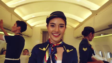 cabin crew or air hostess working in airplane