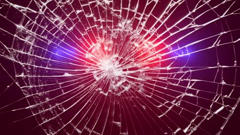 broken glass with ambulance and police lights flashing. shattered glass with pulsating red and blue ambulance and police lights. for emergency, accident, danger, security concepts