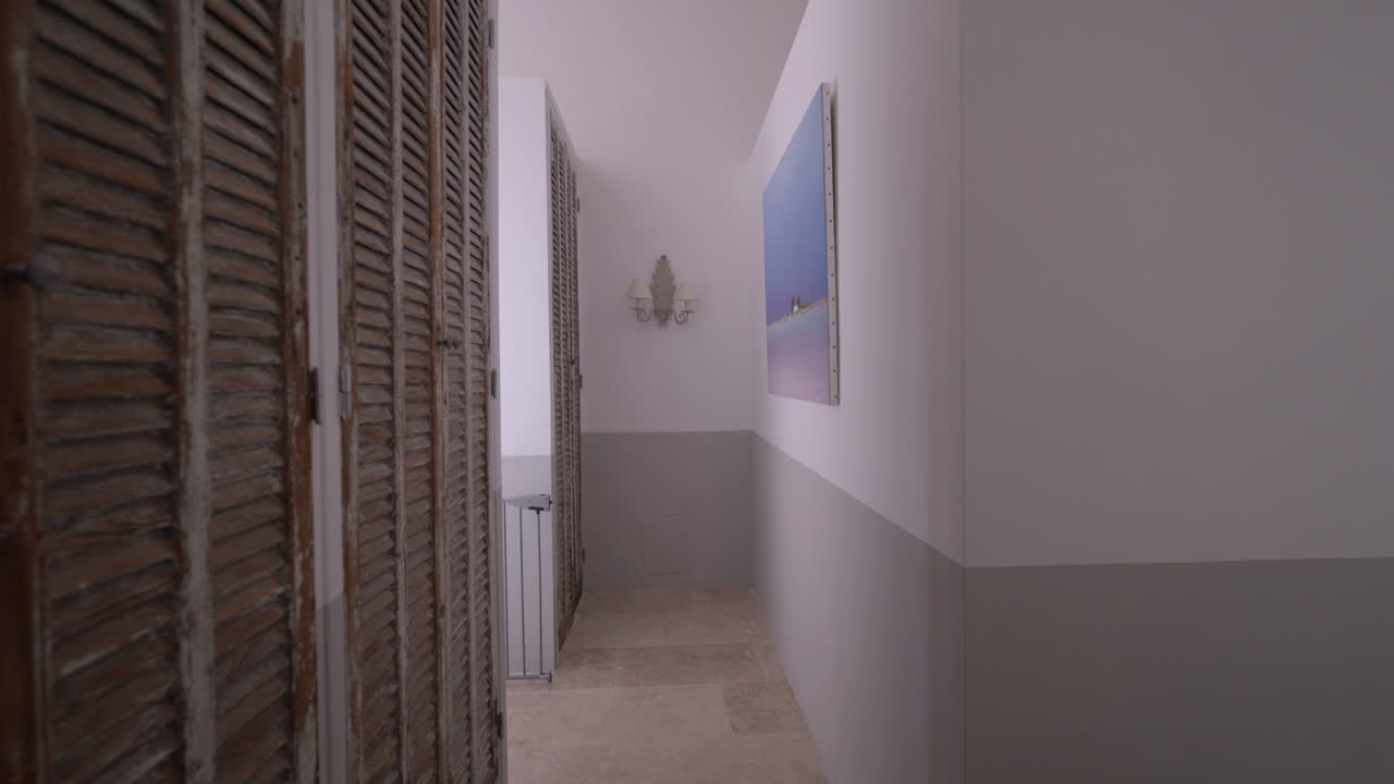 Interior view of narrow modern hallway inside french architectural house.