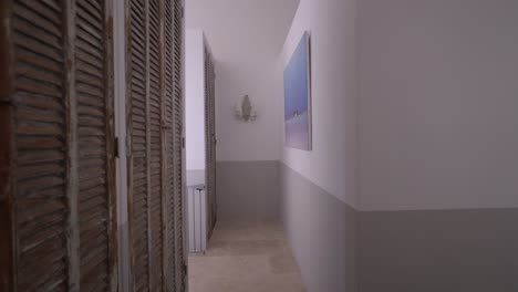 interior view of narrow modern hallway inside french architectural house.