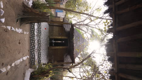 vertical-wooden-hut-house-in-Senegal-africa-village-tribe,-remote-travel-destination-in-forest-discovery-different-African-ethics-way-of-living