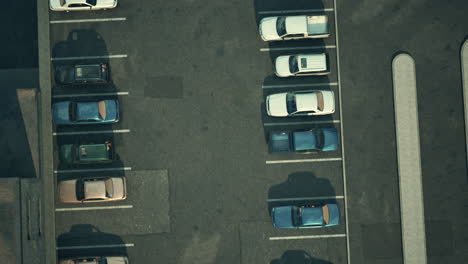 a parking lot with several parked cars