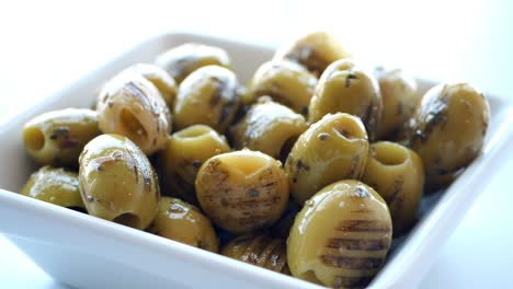 Turkish-grilled-olives-with-olive-and-tomato-on-plate-,