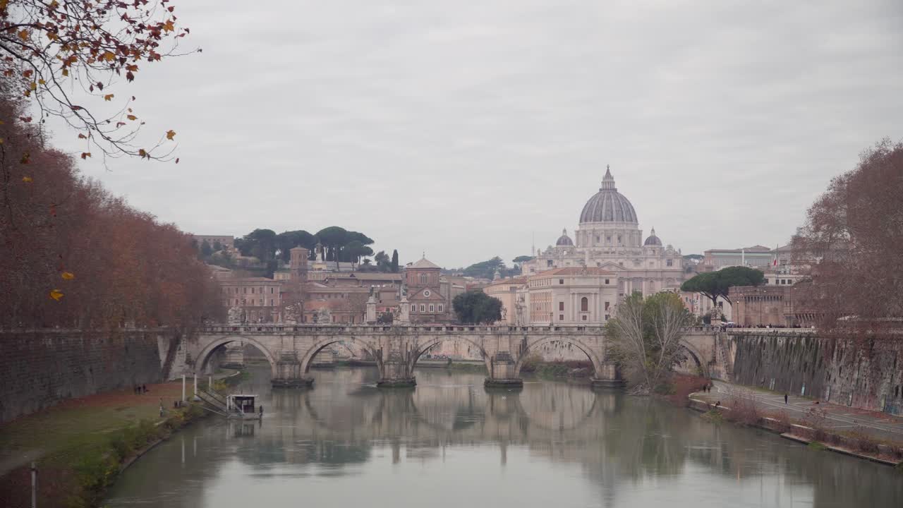 Camera shot of river Tiber in Rome and Basilica di San Pietro