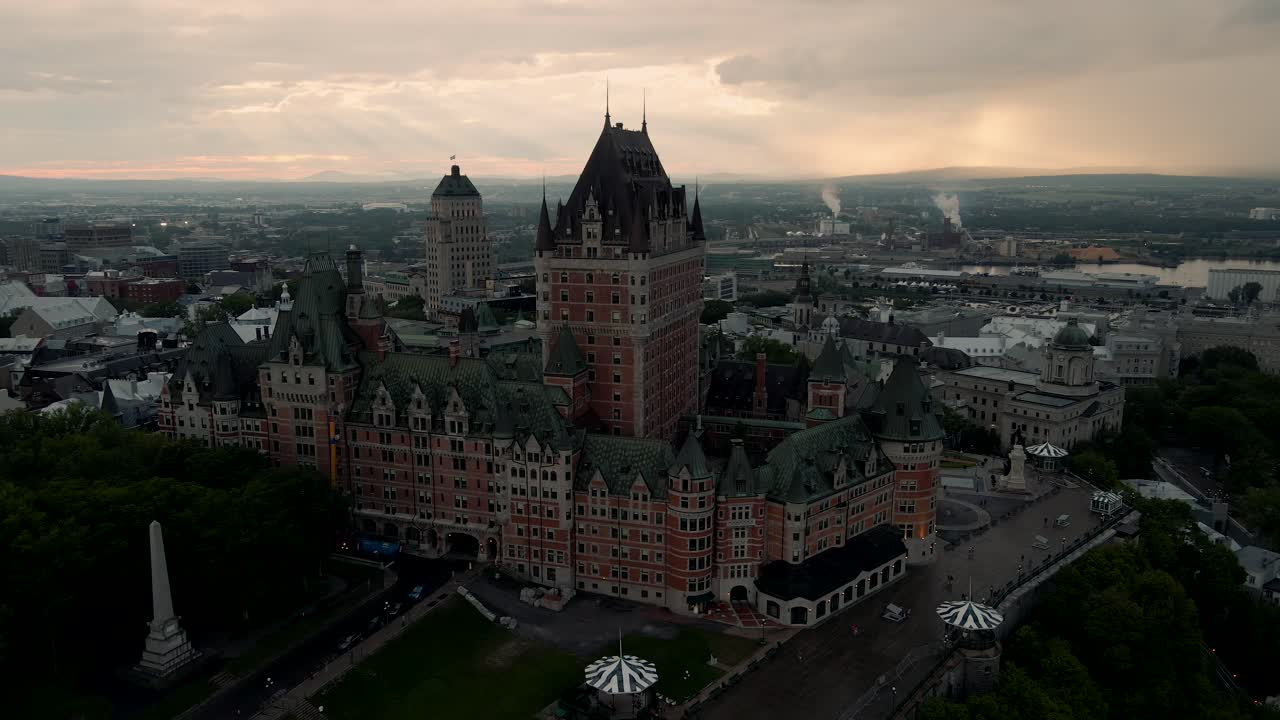 Elegant aerial approach of luxurious Hotel Chateau Frontenac at sunset, Quebec