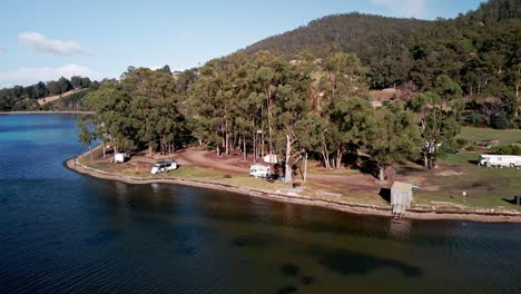 campers motorhomes at gordon foreshore reserve campground by the sea in tasmania, australia