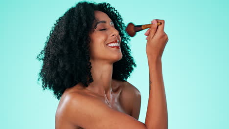 makeup, beauty and woman with a brush in a studio
