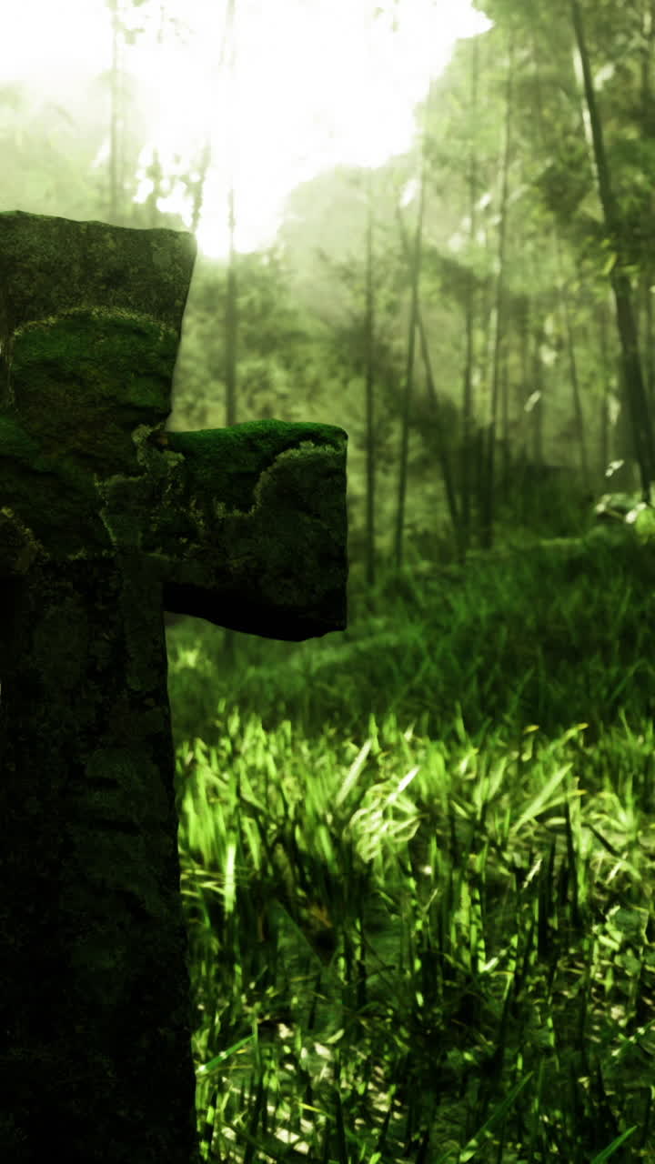 Moss covered cross stands tall in a serene forest landscape at dawn