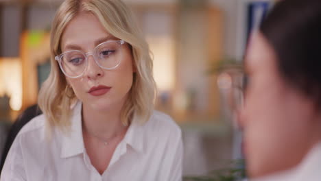 close-up of woman's face during business negotiations