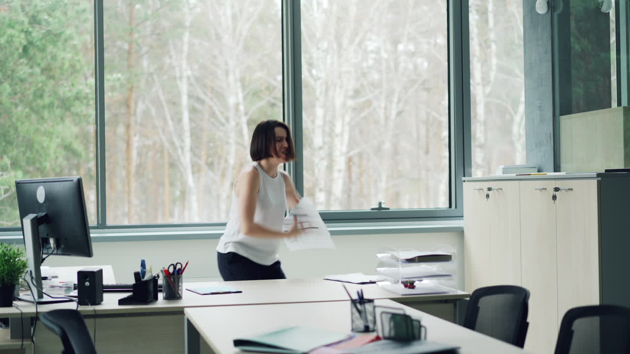 Woman Dancing in Office