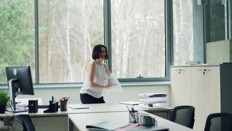 woman dancing in office