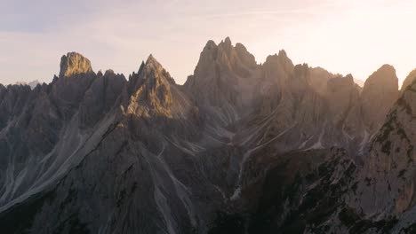 Aerial-Pullback-Reveals-Incredible-Mountain-Ledge-with-Beautiful-Mountains-in-Background