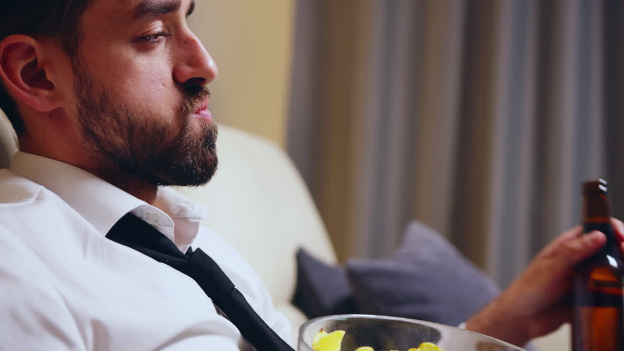 Side view of businessman drinking beer