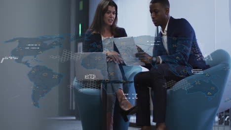 animation of world map and data processing over diverse male and female business colleague talking