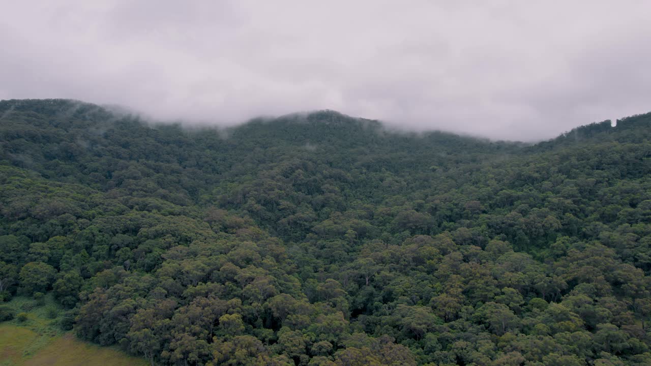 Aerial drone footage of cloudy and foggy mountain tops