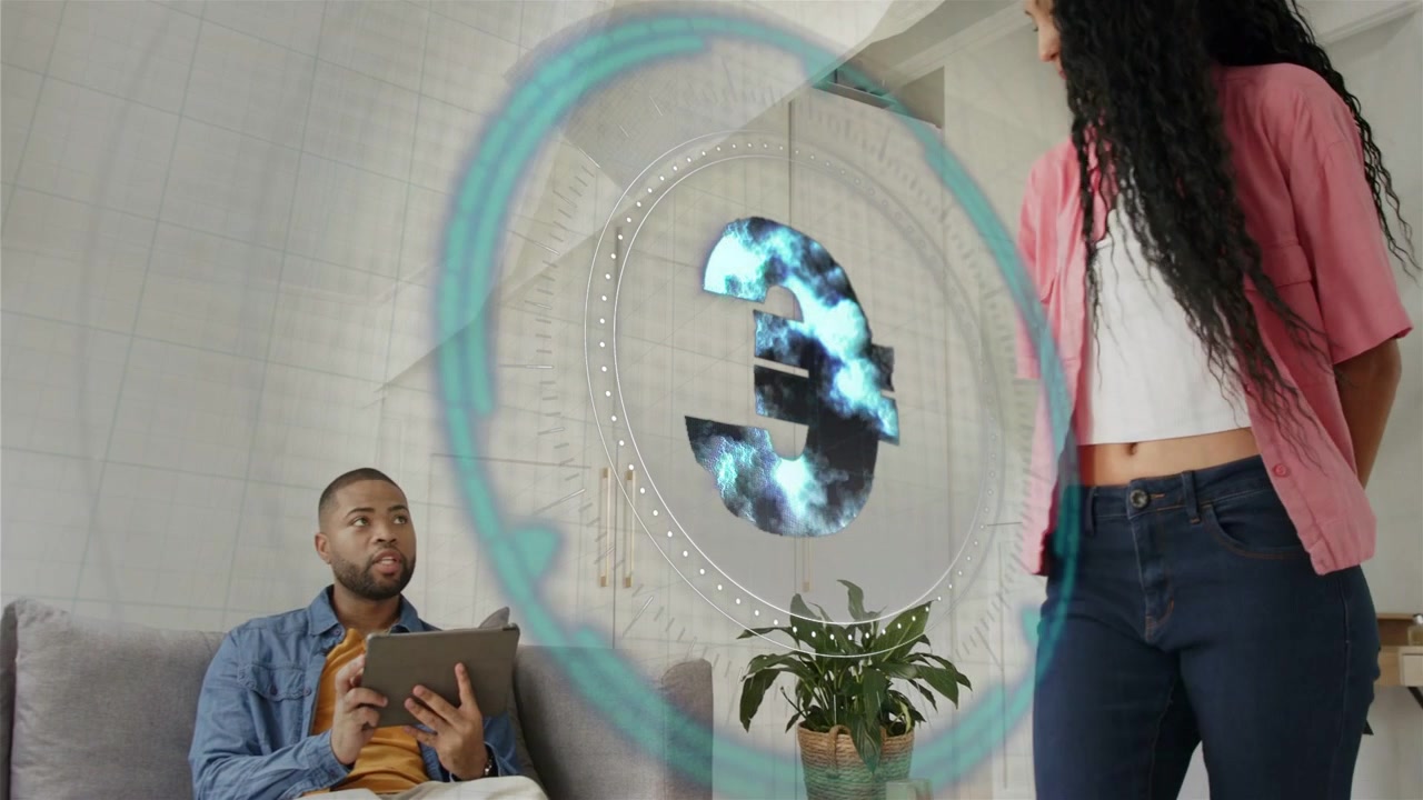 Seated man tapping tablet and animating AR HUD, woman approaching holding folded card for home tech