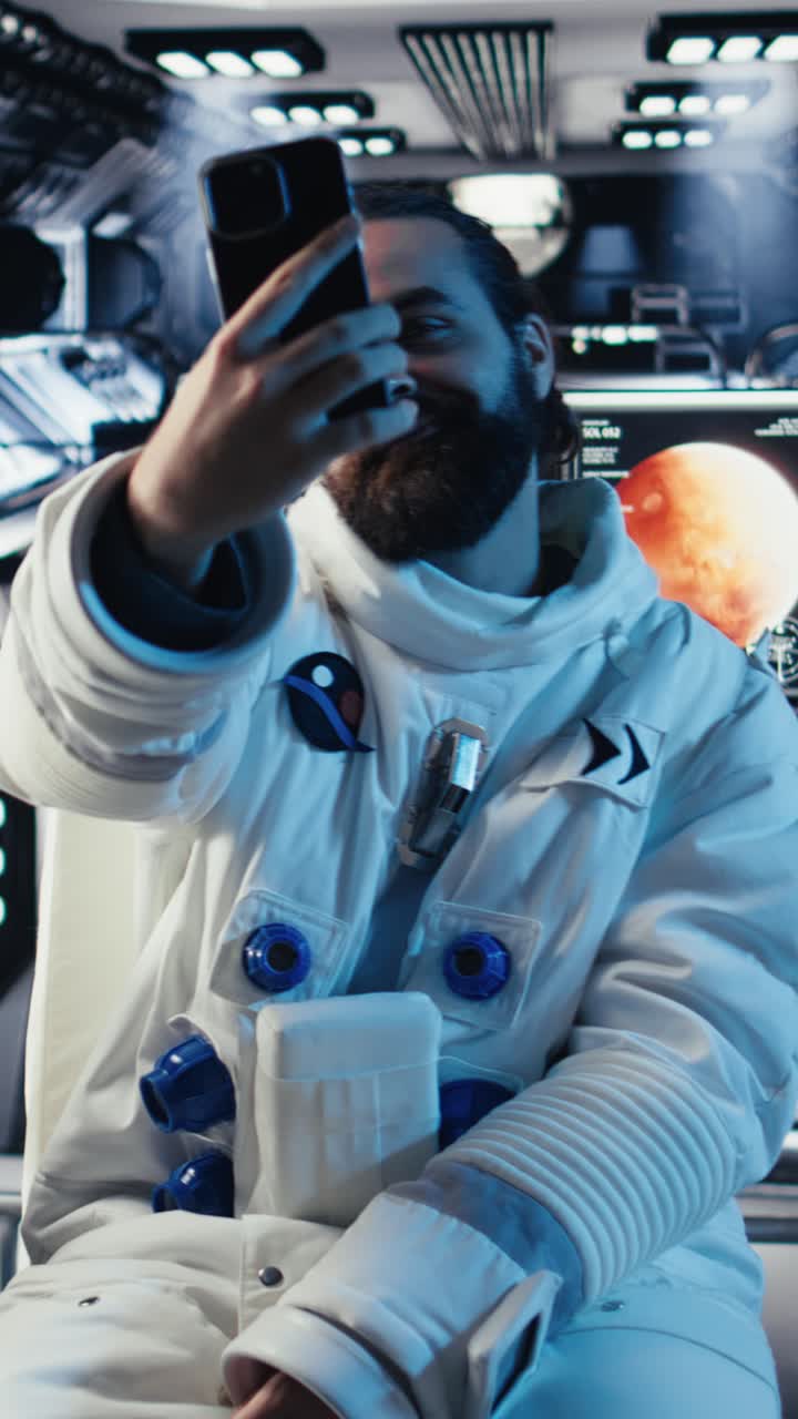 Vertical video Astronauts flying together in starship, looking at isolated screen monitor