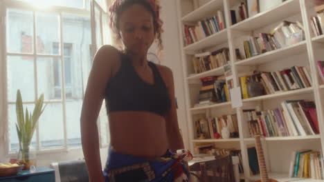 african-american girl dancing energetically at home