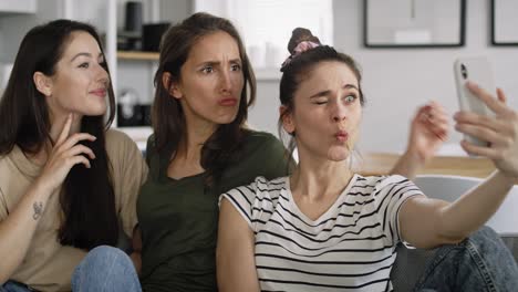 Handheld-video-of-three-best-friends-taking-selfie