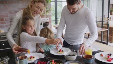 Family-garnishing-food-at-dining-table-in-a-comfortable-home-4k