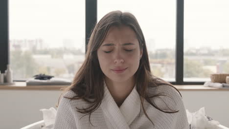 Sad-Woman-Wearing-Bathrobe-Crying-In-The-Bathroom-At-Home